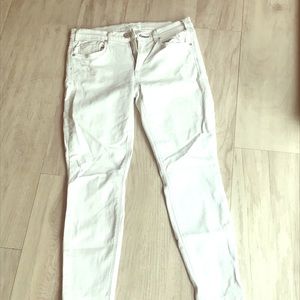 Off White McGuire jeans lightly distressed.